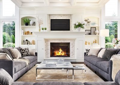 living room facing fireplace with 2 gray couches